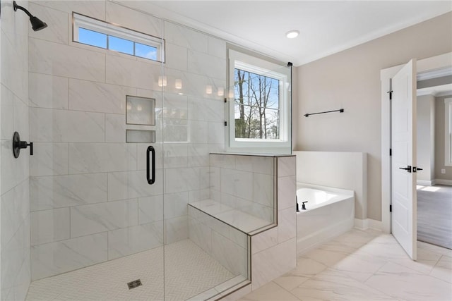 bathroom featuring baseboards, ornamental molding, a shower stall, a bath, and marble finish floor