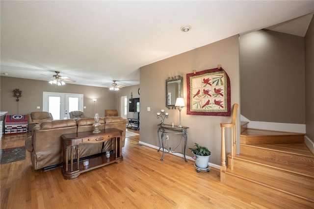 417 Mcgill Cir, Iva, SC 29655 - living room with light wood-style flooring, ceiling fan, french doors, and stairs