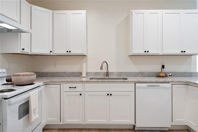 kitchen with white appliances, white cabinetry, a sink, and exhaust hood