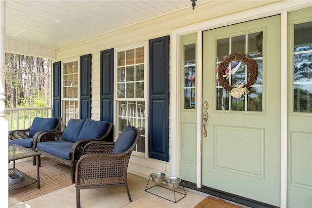 entrance to property featuring covered porch