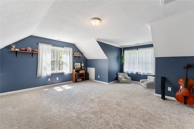 sitting room featuring lofted ceiling, baseboards, a textured ceiling, and carpet floors