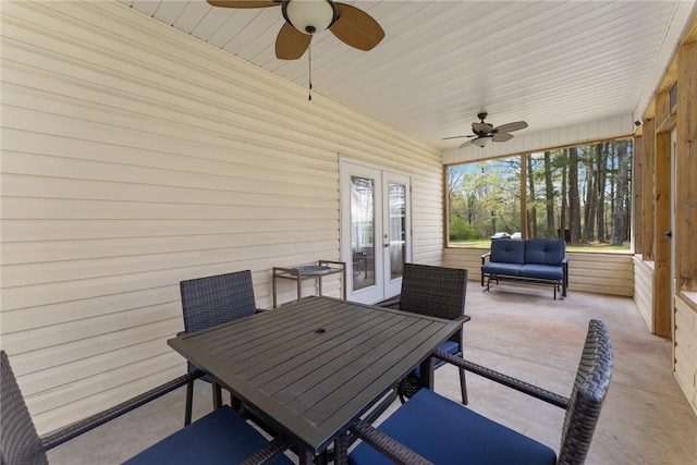view of patio / terrace featuring outdoor dining space, french doors, and a ceiling fan
