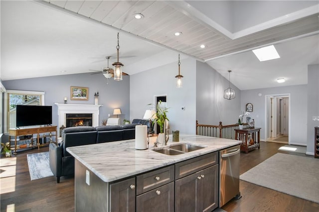 19 Spy Glass Ln, Salem, SC 29676 - kitchen featuring a sink, stainless steel dishwasher, vaulted ceiling, and a warm lit fireplace