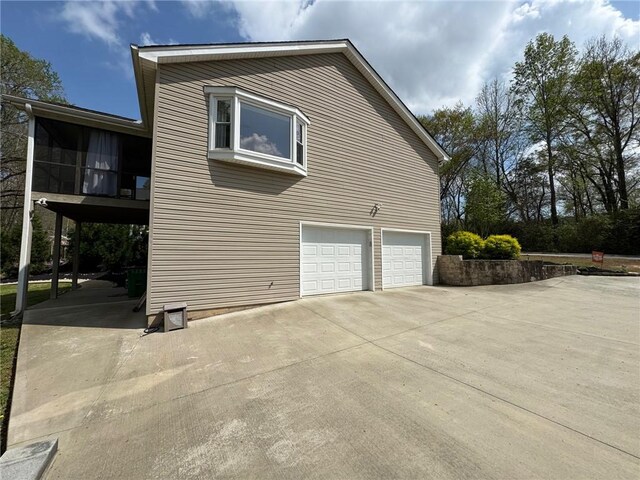 15009 Beacon Ridge Dr, Seneca, SC 29678 - view of side of property with a garage and concrete driveway