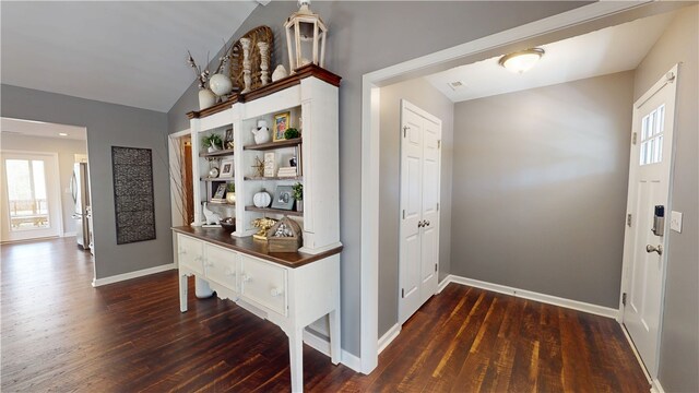 15009 Beacon Ridge Dr, Seneca, SC 29678 - foyer featuring dark wood-style floors, lofted ceiling, and baseboards