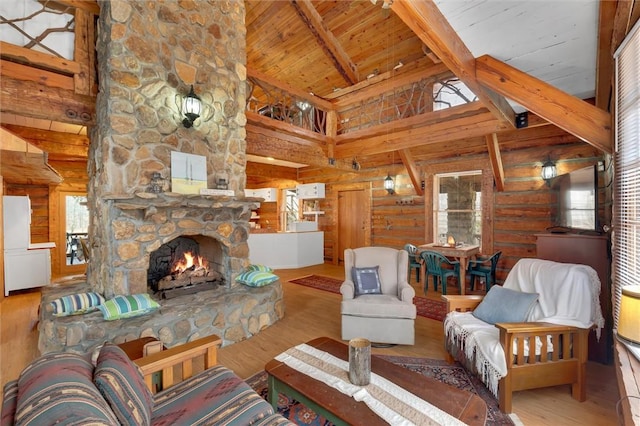 124-130 S Port Bass Dr, Fair Play, SC 29643 - living area featuring beamed ceiling, wooden ceiling, wood finished floors, and a fireplace