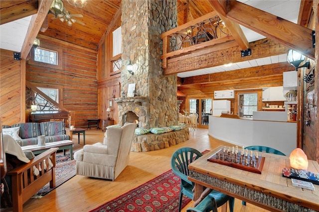 124-130 S Port Bass Dr, Fair Play, SC 29643 - living area featuring a ceiling fan, wood ceiling, wooden walls, beamed ceiling, and wood finished floors