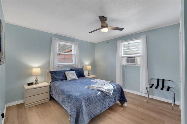 124-130 S Port Bass Dr, Fair Play, SC 29643 - bedroom with cooling unit, ceiling fan, light wood finished floors, and baseboards