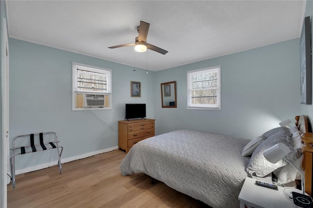 124-130 S Port Bass Dr, Fair Play, SC 29643 - bedroom with baseboards, multiple windows, ceiling fan, and wood finished floors