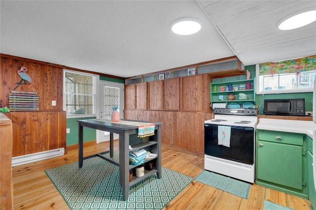 124-130 S Port Bass Dr, Fair Play, SC 29643 - kitchen with a baseboard heating unit, black microwave, light wood-style flooring, electric range, and open shelves
