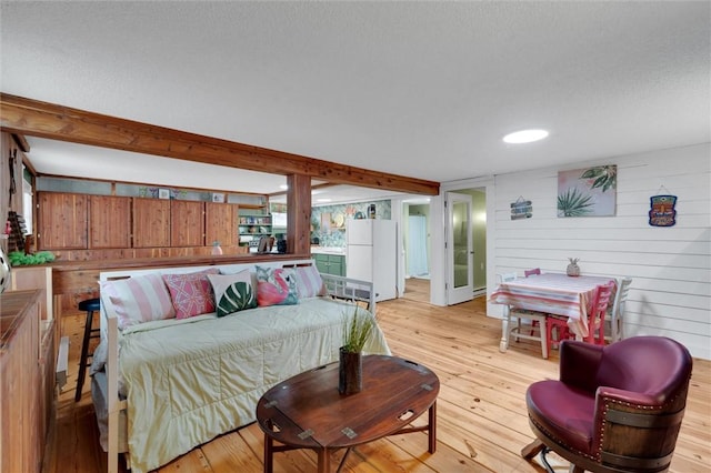 124-130 S Port Bass Dr, Fair Play, SC 29643 - living room with a textured ceiling, light wood finished floors, wooden walls, and beam ceiling