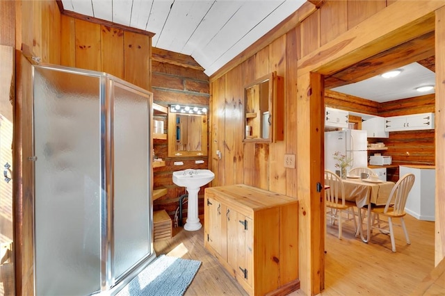124-130 S Port Bass Dr, Fair Play, SC 29643 - full bathroom featuring wooden walls, hardwood / wood-style flooring, a stall shower, and lofted ceiling