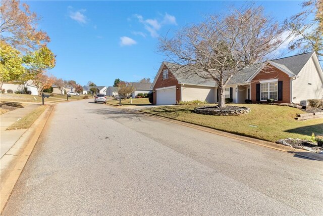 view of street featuring sidewalks, a residential view, and curbs