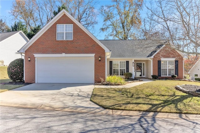 view of front of house with brick siding, a front yard, an attached garage, and driveway