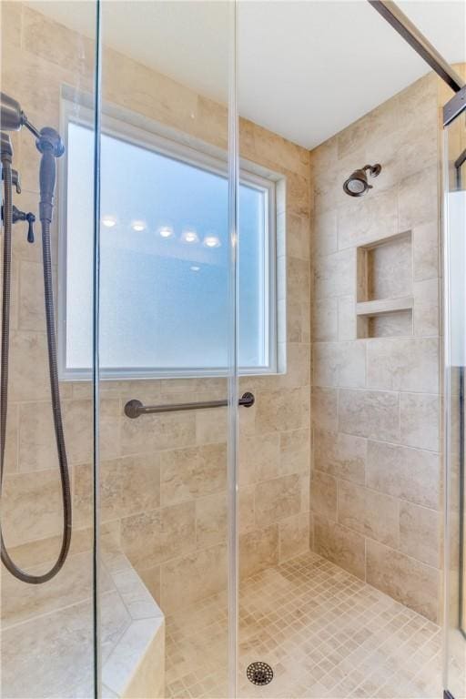 bathroom with a shower stall