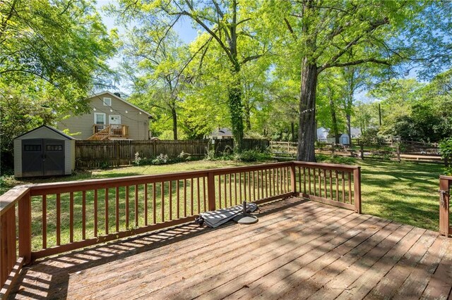 415 Watson Ave, Anderson, SC 29625 - deck with a yard, a fenced backyard, an outdoor structure, and a shed