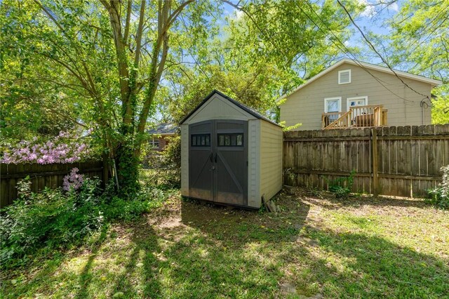 view of shed with a fenced backyard