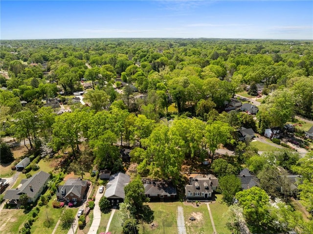birds eye view of property featuring a residential view and a view of trees