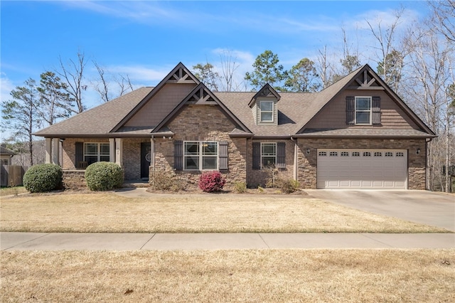 craftsman-style house featuring driveway, stone siding, a garage, and roof with shingles