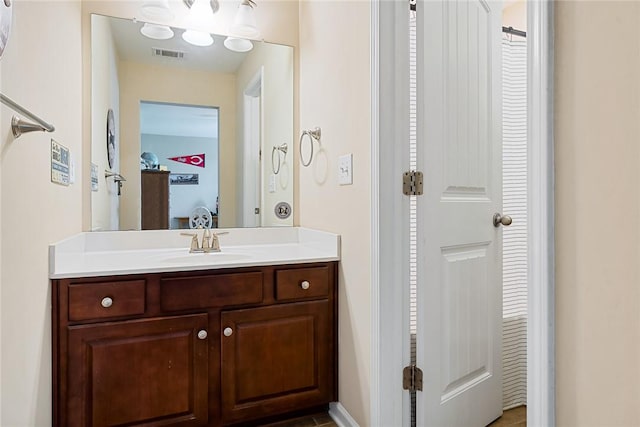 bathroom featuring vanity and visible vents