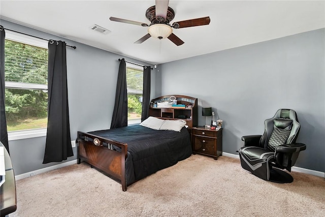bedroom with visible vents, baseboards, and carpet