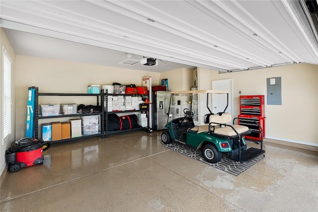 garage with a garage door opener and electric panel