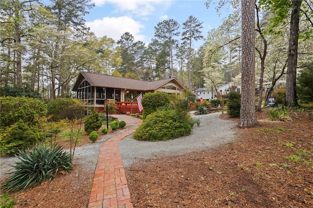 view of front of home with a sunroom