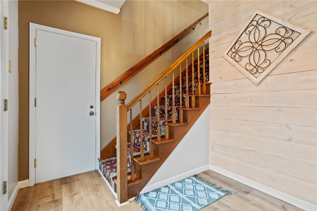 stairs with wood finished floors