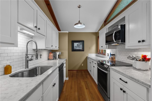 3 Windward Ct, Salem, SC 29676 - kitchen featuring stainless steel appliances, white cabinets, vaulted ceiling, tasteful backsplash, and dark wood finished floors