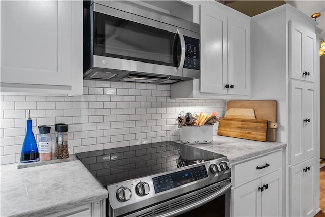 3 Windward Ct, Salem, SC 29676 - kitchen with stainless steel appliances, white cabinetry, and backsplash