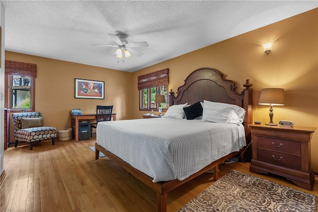 3 Windward Ct, Salem, SC 29676 - bedroom featuring hardwood / wood-style flooring, a textured ceiling, and ceiling fan