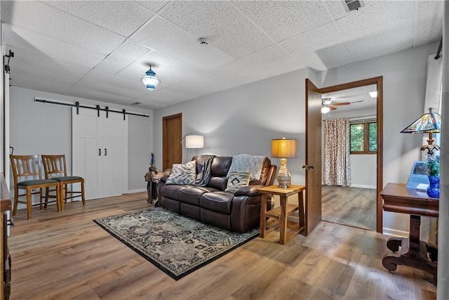 3 Windward Ct, Salem, SC 29676 - living room featuring a barn door, wood finished floors, ceiling fan, and a drop ceiling