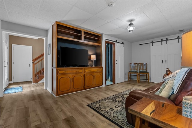3 Windward Ct, Salem, SC 29676 - living area with a barn door, stairway, and wood finished floors