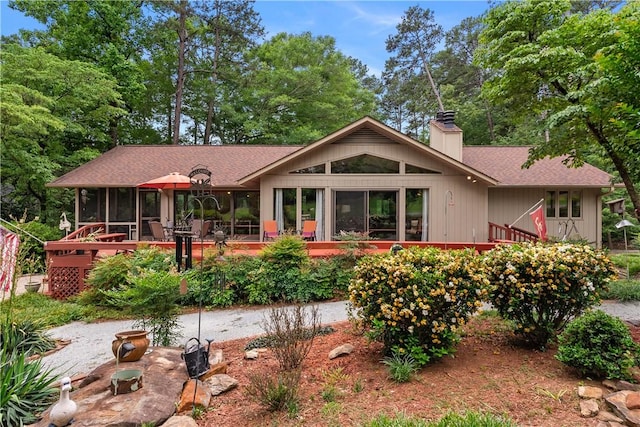 3 Windward Ct, Salem, SC 29676 - rear view of property featuring a sunroom, a chimney, roof with shingles, and a wooden deck