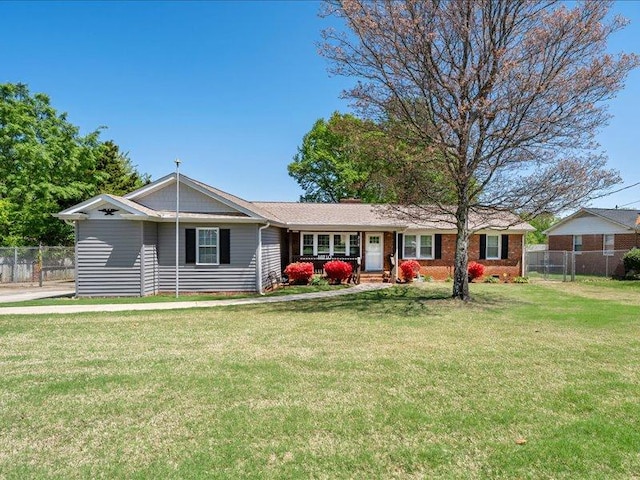 single story home with fence and a front yard
