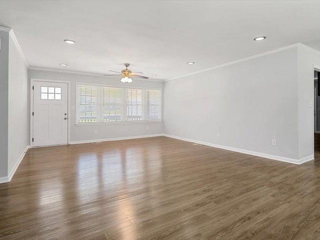 unfurnished living room with ornamental molding, a ceiling fan, and a healthy amount of sunlight