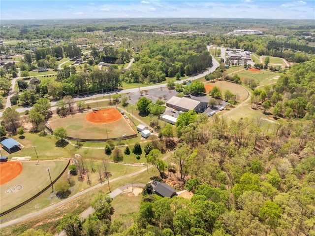 bird's eye view featuring a forest view