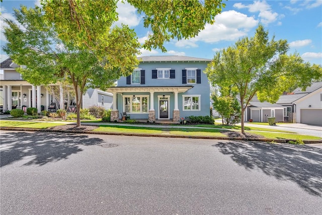 view of front of home featuring a front lawn and covered porch