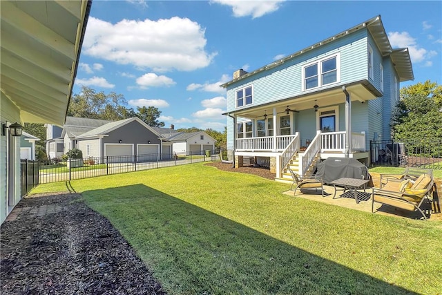 rear view of property with a chimney, a yard, a fenced backyard, and ceiling fan