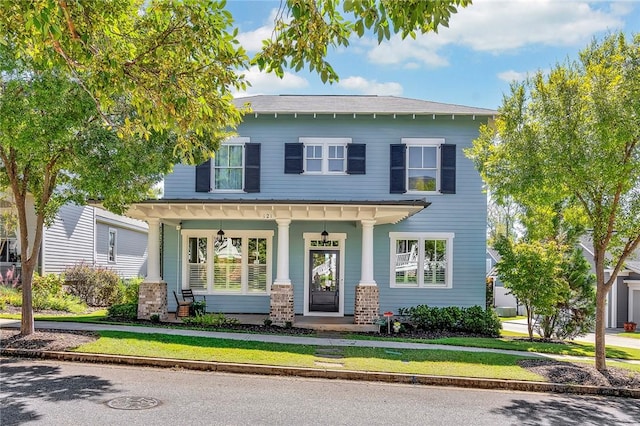 view of front of house featuring a porch and a front yard