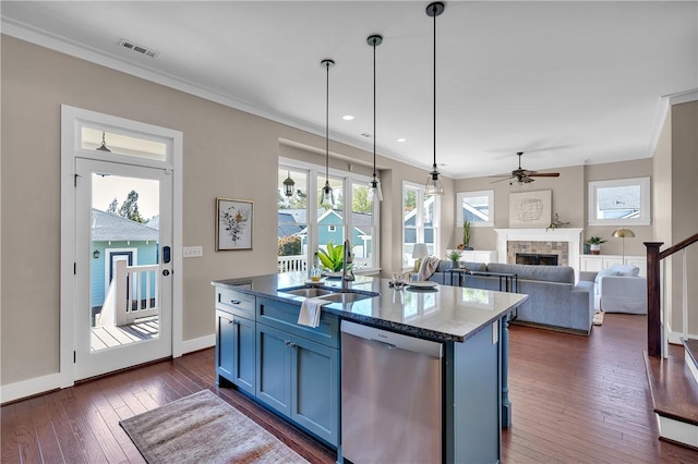 kitchen featuring blue cabinets, dishwasher, ceiling fan, a fireplace, and ornamental molding
