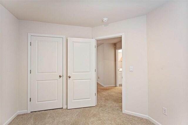 407 Oakmont Valley Trl, Seneca, SC 29678 - unfurnished bedroom featuring baseboards and light carpet