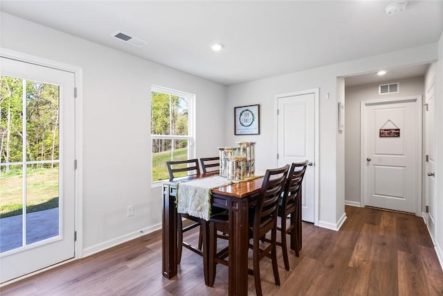 dining room featuring baseboards, dark wood-style floors, visible vents, and recessed lighting
