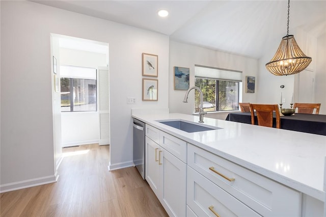 204 Harbor Cove Dr, Salem, SC 29676 - kitchen with a sink, light countertops, light wood-type flooring, a chandelier, and stainless steel dishwasher