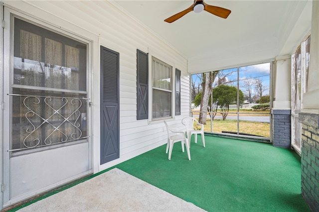 view of patio / terrace featuring a ceiling fan and covered porch