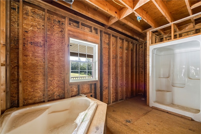 bathroom with a garden tub