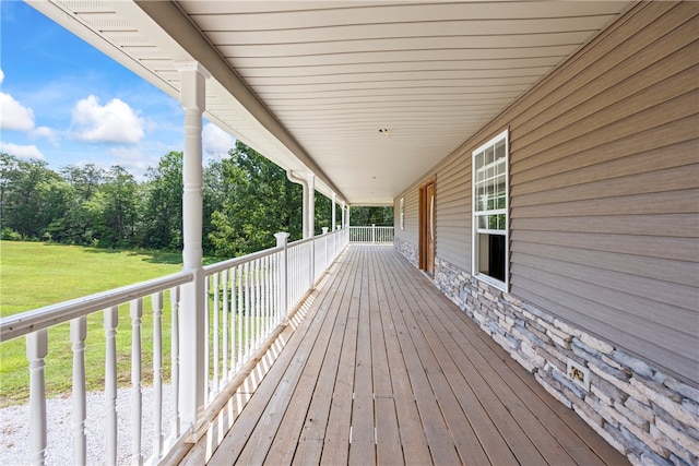 wooden deck with a yard