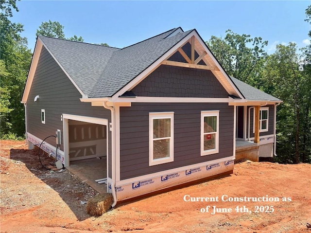1112 Little River View Dr, Seneca, SC 29672 - view of property exterior with roof with shingles, an attached garage, and crawl space