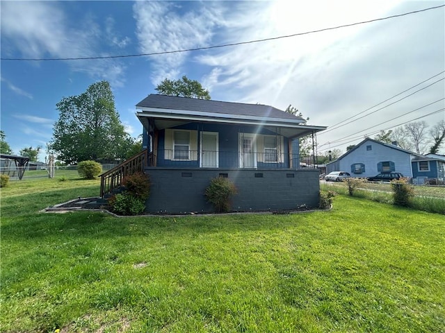 bungalow-style house featuring a front yard and crawl space