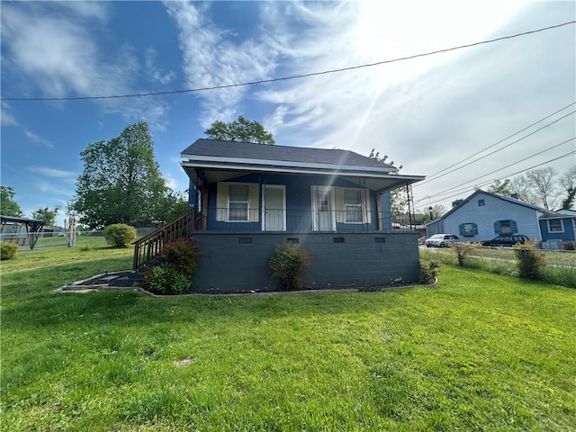 bungalow-style house featuring a front yard and crawl space